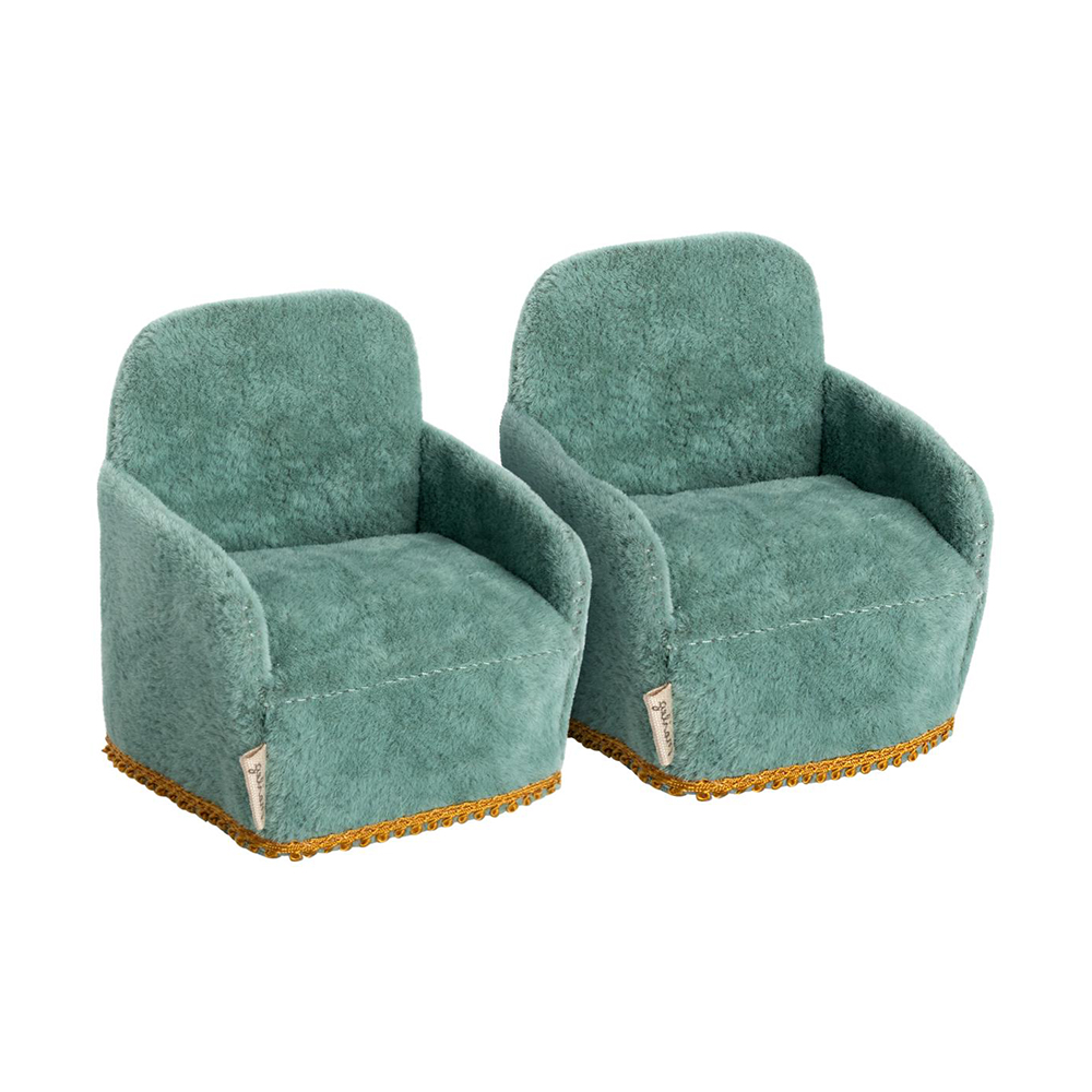 2 maileg velvety green chars with gold trim at the bottom